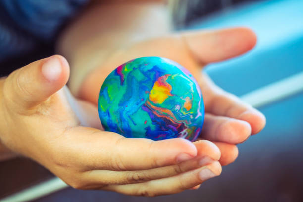 the world being held in two hands